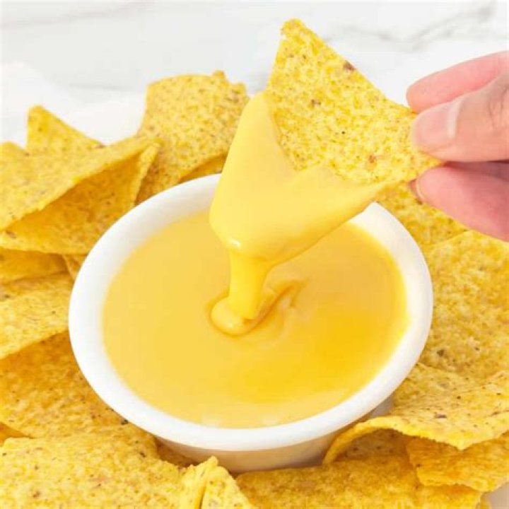 How do you keep cheese sauce from breaking?