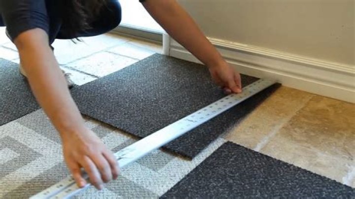 How do you put down carpet tiles?