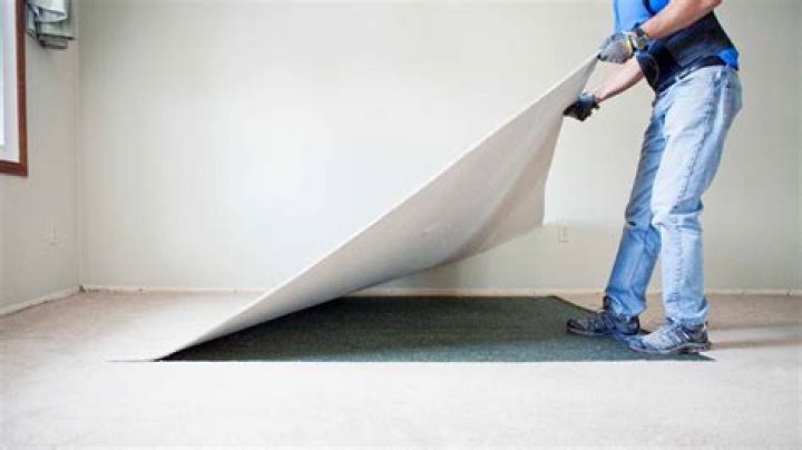 How do you remove glued carpet?
