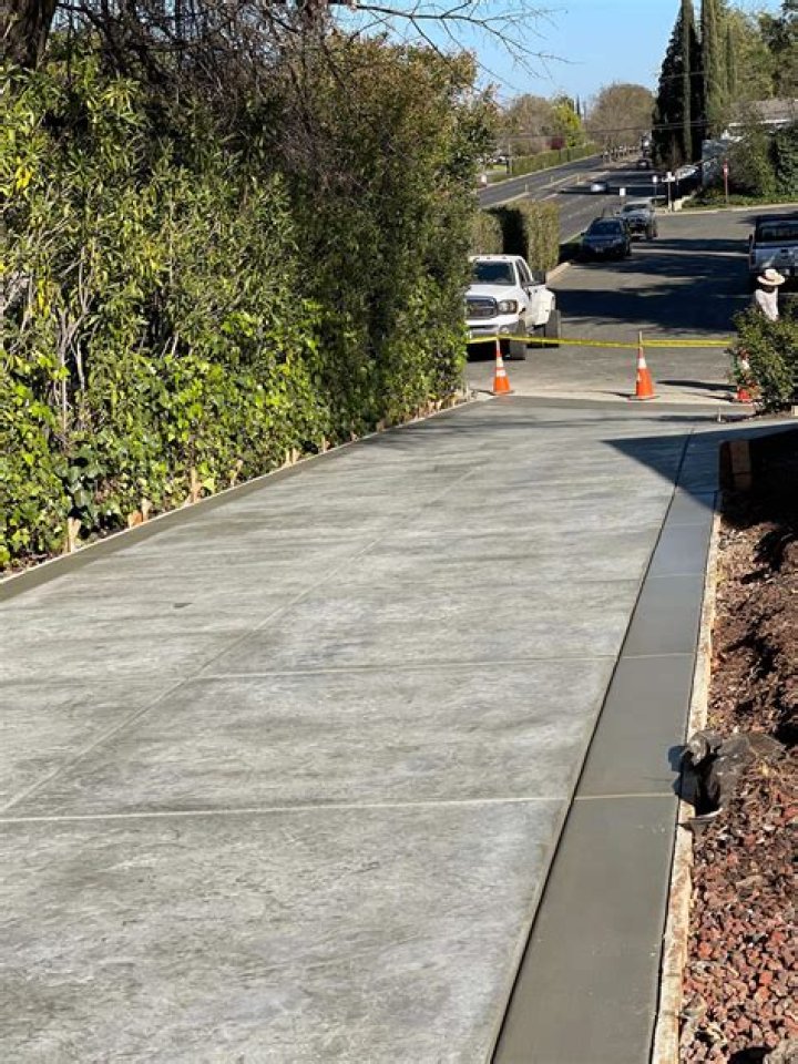 How thick are most concrete sidewalks?