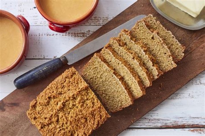 What does scalded milk help yeast breads do?