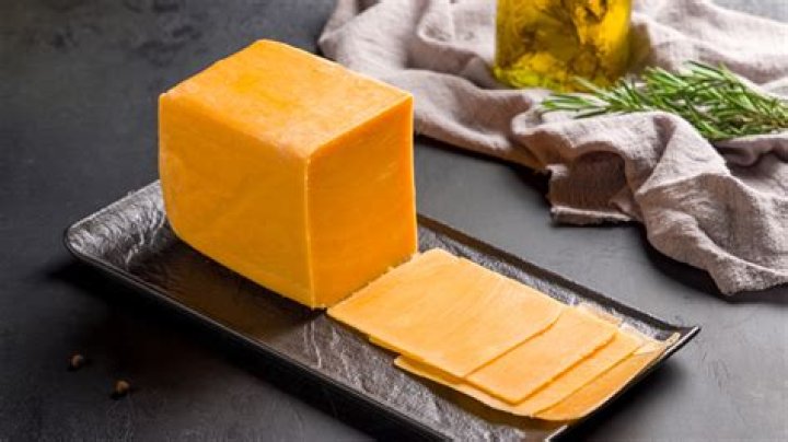 Why does cheddar cheese become greasy after melted?