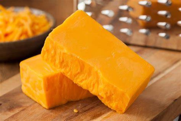 Why is cheddar cheese orange?
